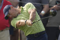 Rory McIlroy, of Northern Ireland, hits his tee shot on the 16th hole during the first round of the PGA Championship golf tournament Thursday, May 19, 2022, in Tulsa, Okla. (AP Photo/Eric Gay)