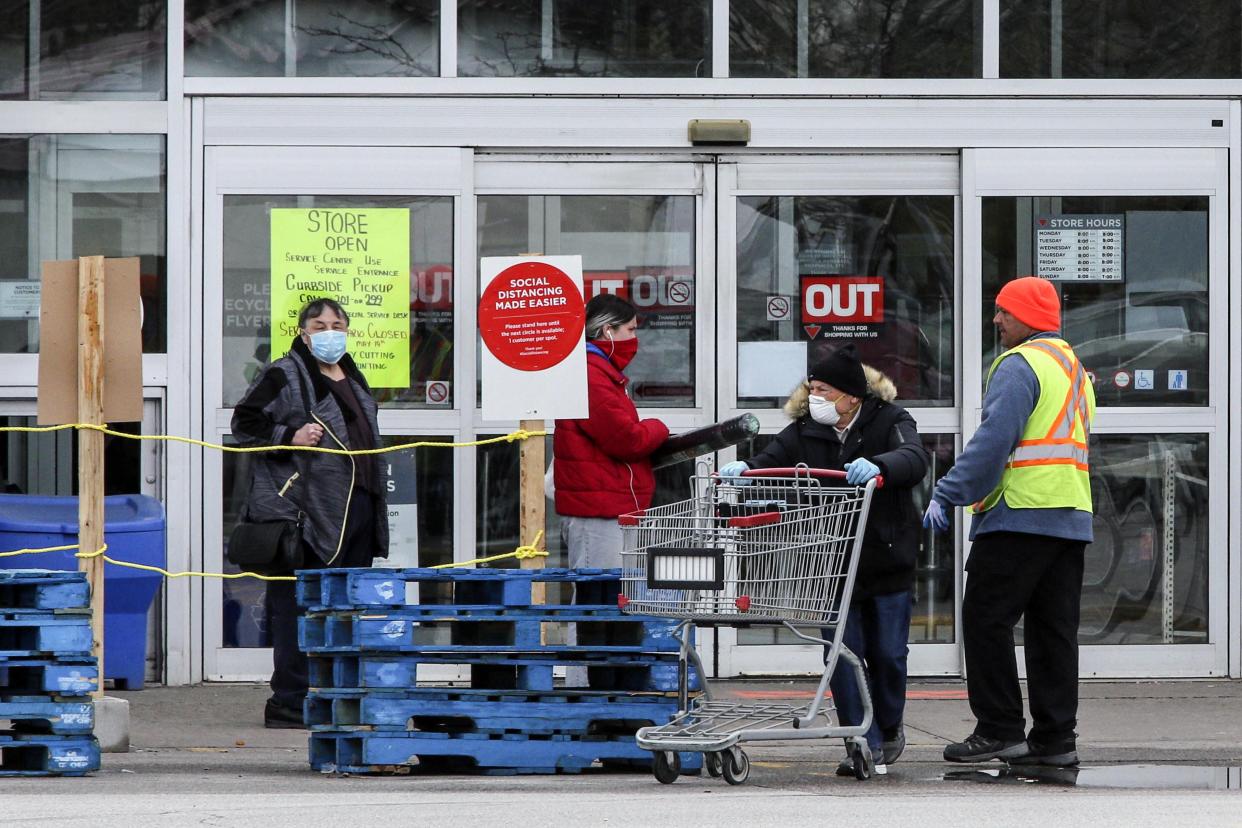 TORONTO, ON - MAY 11: Customers wait to enter a Canadian Tire Store at 2129 St. Clair Ave. W. on May 11, 2020. Stores retail businesses are opening to the public after being closed to help stop the spread of COVID-19.        (Andrew Francis Wallace/Toronto Star via Getty Images)