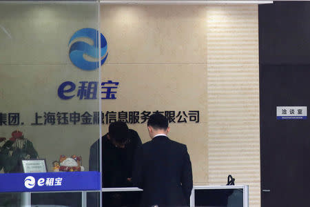 A branch office of Ezubao, once China's biggest P2P lending platform is seen in Nantong, Jiangsu province, China, December 9, 2015. Picture taken December 9, 2015. REUTERS/Stringer ATTENTION EDITORS - THIS IMAGE WAS PROVIDED BY A THIRD PARTY. EDITORIAL USE ONLY. CHINA OUT. NO COMMERCIAL OR EDITORIAL SALES IN CHINA. THIS PICTURE WAS PROCESSED BY REUTERS TO ENHANCE QUALITY. AN UNPROCESSED VERSION HAS BEEN PROVIDED SEPARATELY.