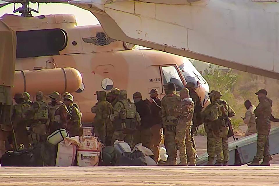 This undated photo distributed by the French military shows Russian mercenaries boarding a helicopter in northern Mali