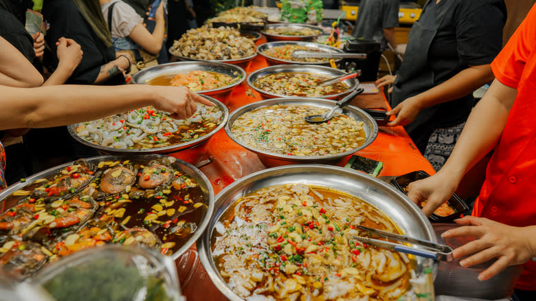 Large group eating Thai food