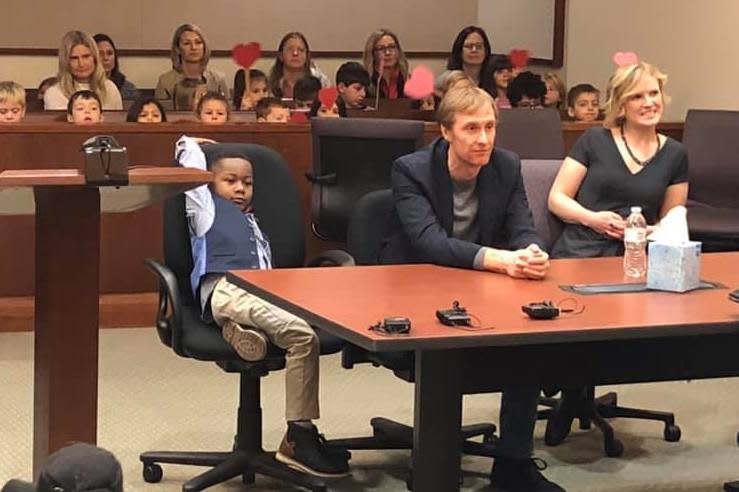 Michael's supporters watched on proudly as he sat beside his new parents: Kent County