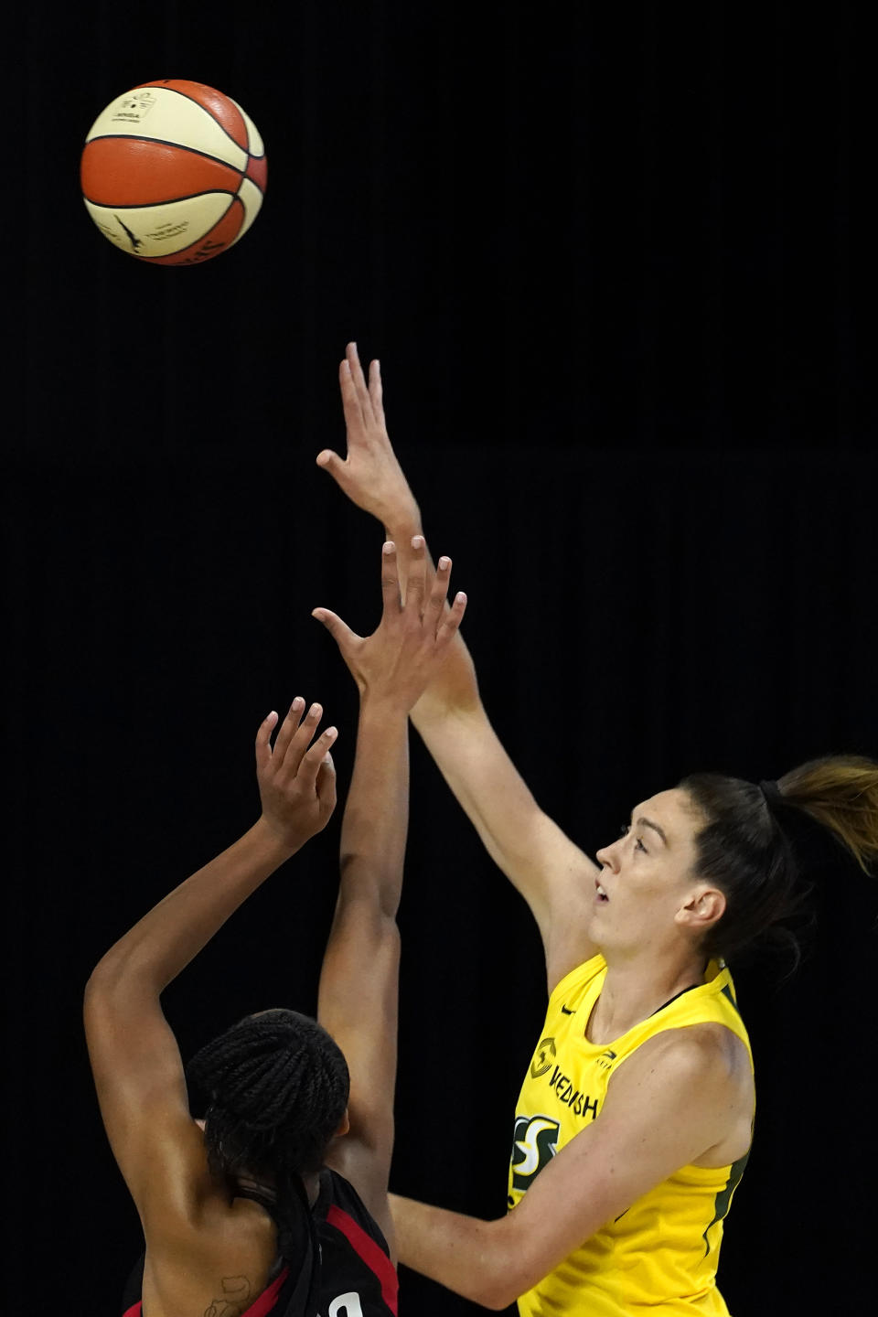 Seattle Storm forward Breanna Stewart (30) shoots over Las Vegas Aces guard Jackie Young during the first half of Game 1 of basketball's WNBA Finals Friday, Oct. 2, 2020, in Bradenton, Fla. (AP Photo/Chris O'Meara)