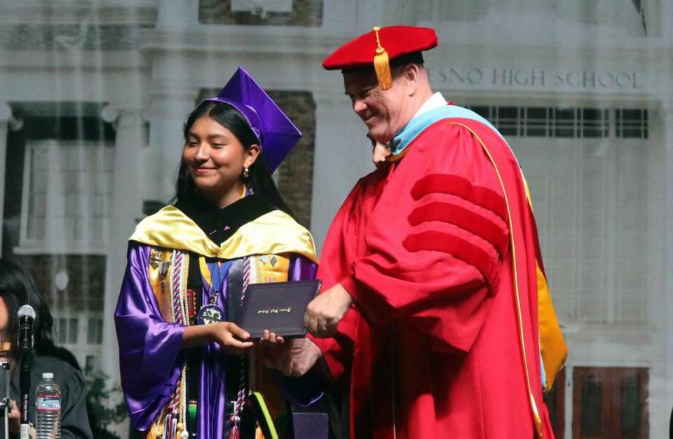 Kaily Matías gets her diploma from superintendent Bob Nelson during the Fresno High graduation ceremony held at the Save Mart Center on June 5, 2023.