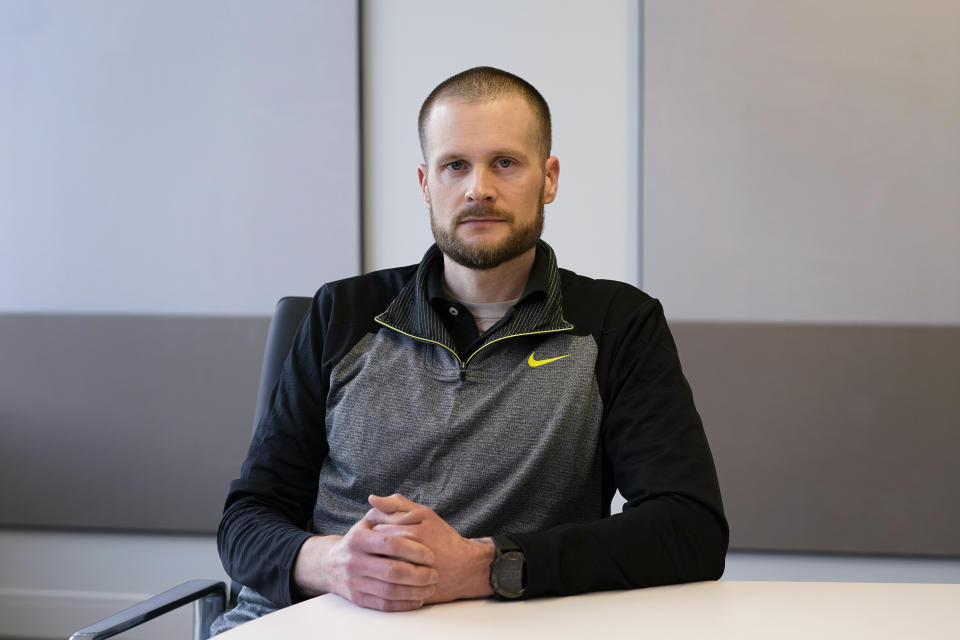 In this Dec. 31, 2020, file photo pardoned Blackwater contractor Evan Liberty poses for a photo in Washington. Liberty is one of four former Blackwater contractors pardoned by President Donald Trump in one of his final acts in office, wiping away their convictions in a 2007 shooting rampage in Baghdad that killed more than a dozen Iraqi civilians. The pardons were met with intense condemnation both in the United States and the Middle East. (AP Photo/Susan Walsh)