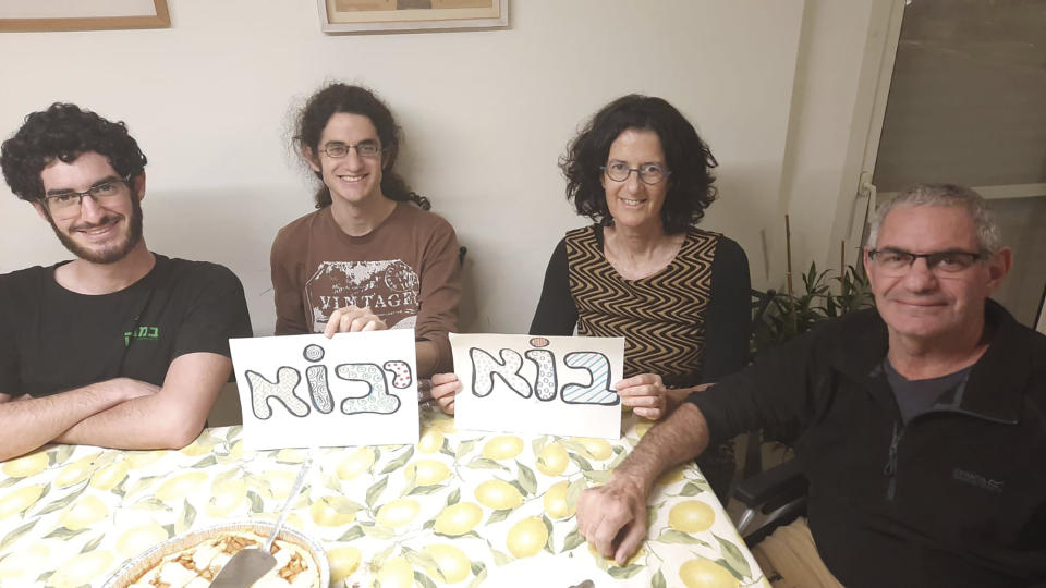 This undated photo released Wednesday Oct. 11, 2023 by Nadav Kipnis, shows him, at left, flanked by his family from left, his brother Yotam Kipnis, his mother Lilach Lea Havron 60 and his father Eviatar Moshe Kipnis 65. Eviatar Moshe Kipnis and Lilach Lea Havron are among the estimated 150 people believed held by Hamas in Gaza following the militant group's stunning incursion in Israel on Saturday. The couple and their health care aide were last heard from Saturday morning, sheltering in their safe room, after militants had begun storming Be'eri, where at least 100 people were later found dead. (Kipnis Family via AP)