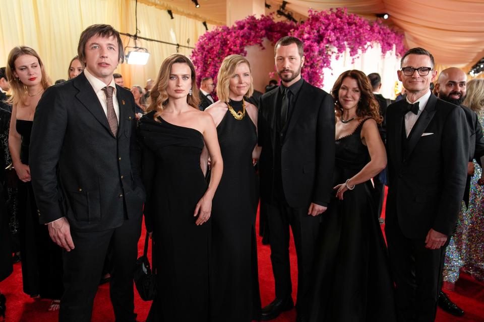 Evgeniy Maloletka, from left, Vasilisa Stepanenko, Michelle Mizner, Mstyslav Chernov, Raney Aronson-Rath and Derl McCrudden arrive at the Oscars on Sunday, March 10, 2024, at the Dolby Theatre in Los Angeles.