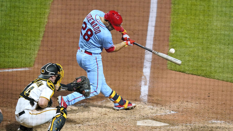 St. Louis Cardinals' Nolan Arenado (28) doubles to left field off Pittsburgh Pirates relief pitcher Wil Crowe, driving in three runs during the ninth inning of a baseball game in Pittsburgh, Saturday, Sept. 10, 2022. (AP Photo/Gene J. Puskar)