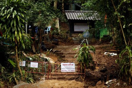 A "Restricted Area" sign is seen in front of the Tham Luang cave complex, after the rescue mission for the 12 boys of the "Wild Boars" soccer team and their coach, in the northern province of Chiang Rai, Thailand July 14, 2018. REUTERS/Tyrone Siu