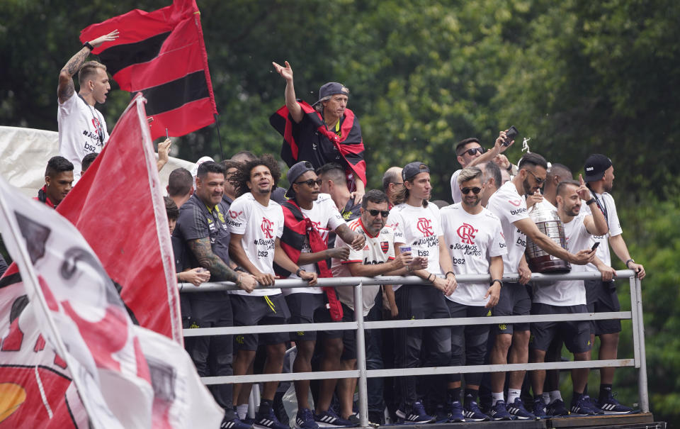 Players of Brazil's Flamengo parade at their arrival in Rio de Janeiro, Brazil, Sunday, Nov. 24, 2019. Flamengo overcame Argentina's River Plate 2-1 in the Copa Libertadores final match on Saturday in Lima to win its second South American title. (AP Photo/Ricardo Borges)