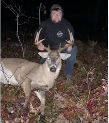 Nicolas Patnode, 19, of Kalkaska poses with an illegal 9-point deer he killed in 2022. Patnode and Zander Garrett face a combined 14-charges after torturing a porcupine and illegally hunting throughout the county during October-November 2022. Both Kalkaska men are due back in court on May 20.