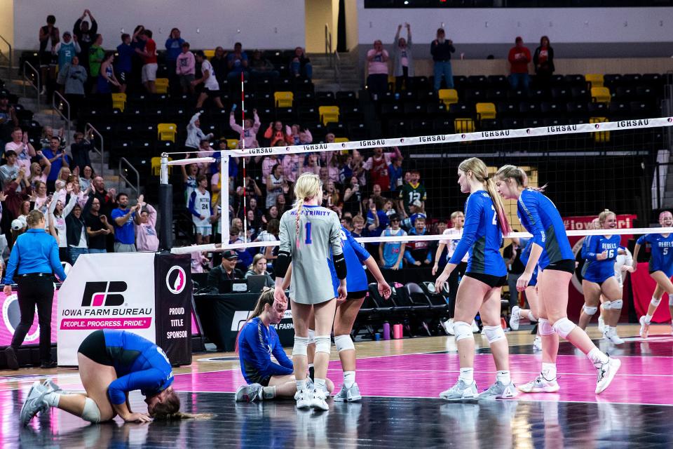 Holy Trinity players react after a Class 1A state volleyball quarterfinal match against Gladbrook-Reinbeck, Tuesday, Nov. 1, 2022, at Xtream Arena in Coralville, Iowa.