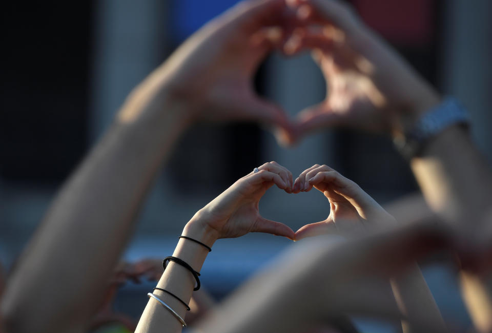 People take part in a vigil in Trafalgar Square, London,&nbsp;for the victims of the attack in Manchester.