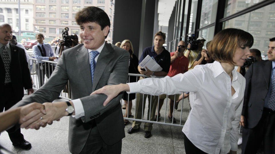 FILE - In this July 28, 2010, file photo, former Illinois Gov. Rod Blagojevich and his wife, Patti, right, arrive at the federal courthouse in Chicago for his corruption trial. Patti Blagojevich made repeated public pleas for her husband’s release from federal prison. Her campaign began in 2018 soon after her husband lost a string of legal appeals that seemed to doom him to remain behind bars until his projected 2024 release date. (AP Photo/M. Spencer Green, File)