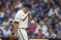 Milwaukee Brewers starting pitcher Aaron Ashby reacts after walking a Chicago Cubs batter during the first inning of a baseball game Wednesday, June 30, 2021, in Milwaukee. (AP Photo/Jeffrey Phelps)