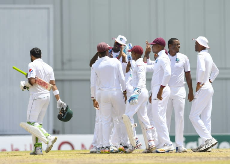 Azhar Ali (L) of Pakistan is dismissed as Shannon Gabriel (2R) of West Indies celebrates with teammates during the 5th and final day of their 2nd Test match at Kensington Oval, Bridgetown, Barbados, May 04, 2017