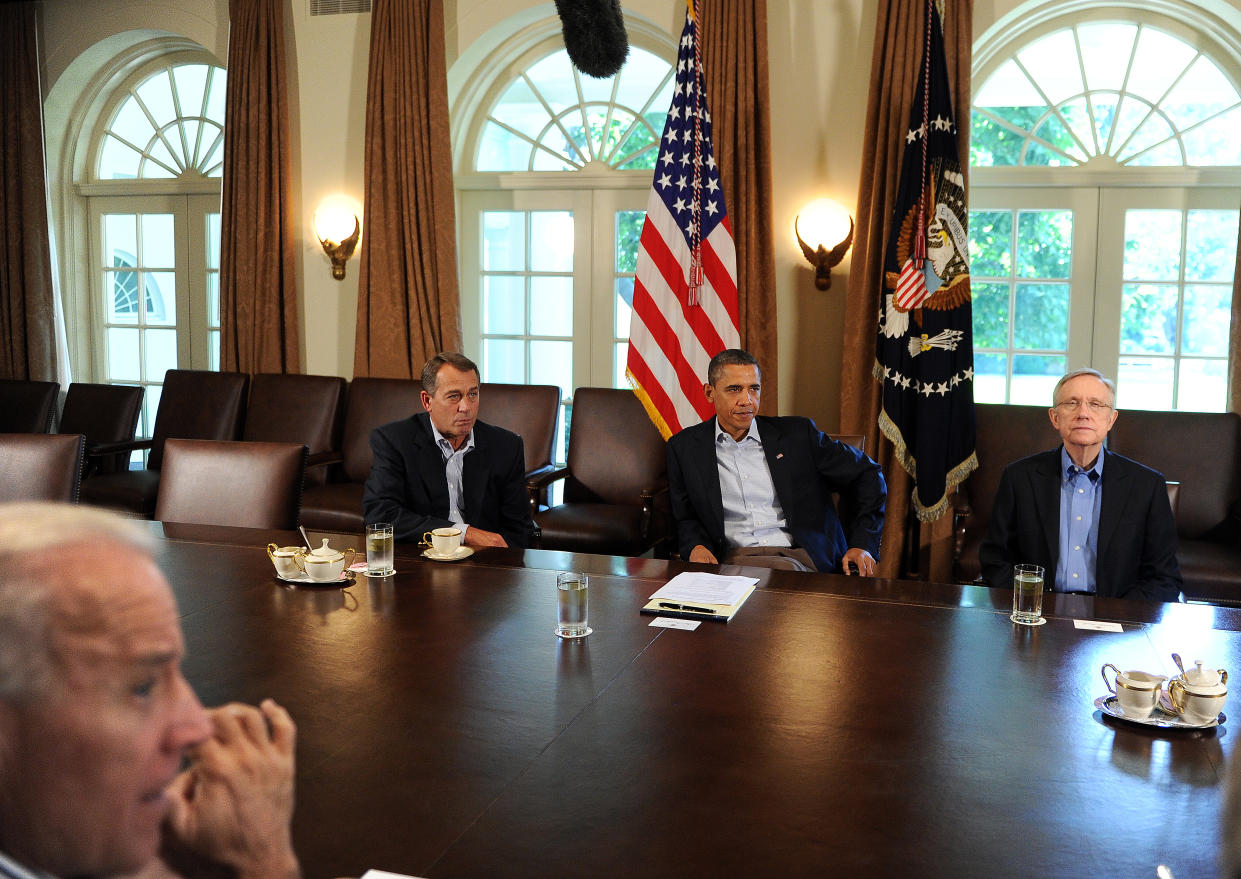 US President Barack Obama (C) speaks during a meeting with US Speaker of the House John Boehner (back-L), Majority Leader Senator Harry Reid (R) and Vice President Joe Biden (L) in the Cabinet Room at the White House in Washington, DC, on July 23, 2011. Obama summoned top lawmakers for crisis talks Saturday on averting an August debt default that could send shockwaves through the fragile global economy. With an August 2 deadline fast approaching, Obama warned that polarized lawmakers must have a plan for raising the $14.3 trillion US debt ceiling by the time world markets pass judgment Monday on the stalemate. AFP Photo/Jewel Samad (Photo credit should read JEWEL SAMAD/AFP via Getty Images)