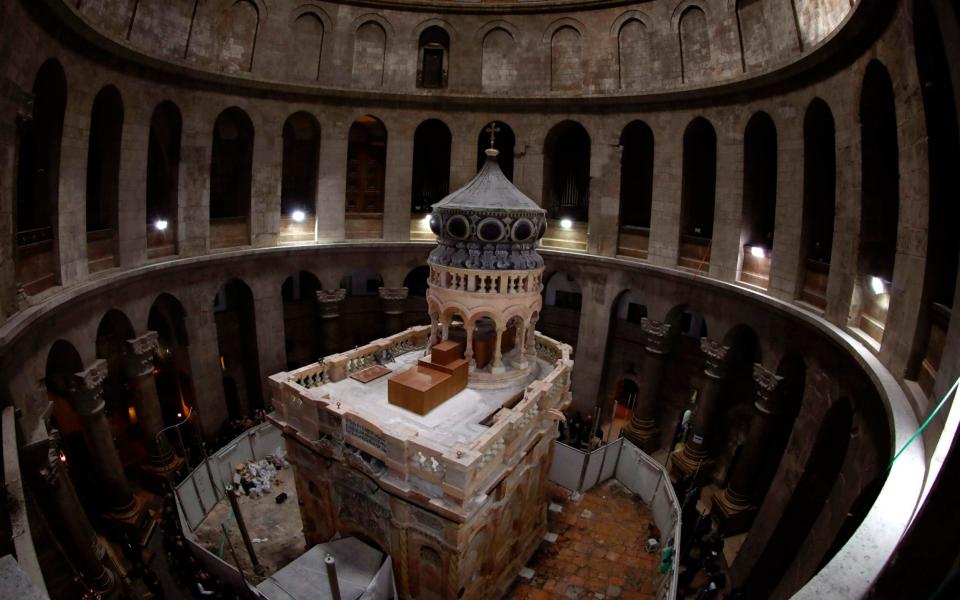 The Edicule is visited by thousands of Christians and non-Christians each year - AFP