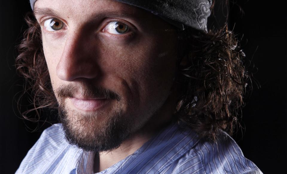 In this March 8, 2012 photo, musician Jason Mraz poses for a portrait in New York. The singer-songwriter, known for feel-good and hippie hits like “I'm Yours” and “The Remedy (I Won't Worry),” released his latest album “Love Is a Four Letter Word,” on Tuesday. (AP Photo/Carlo Allegri)