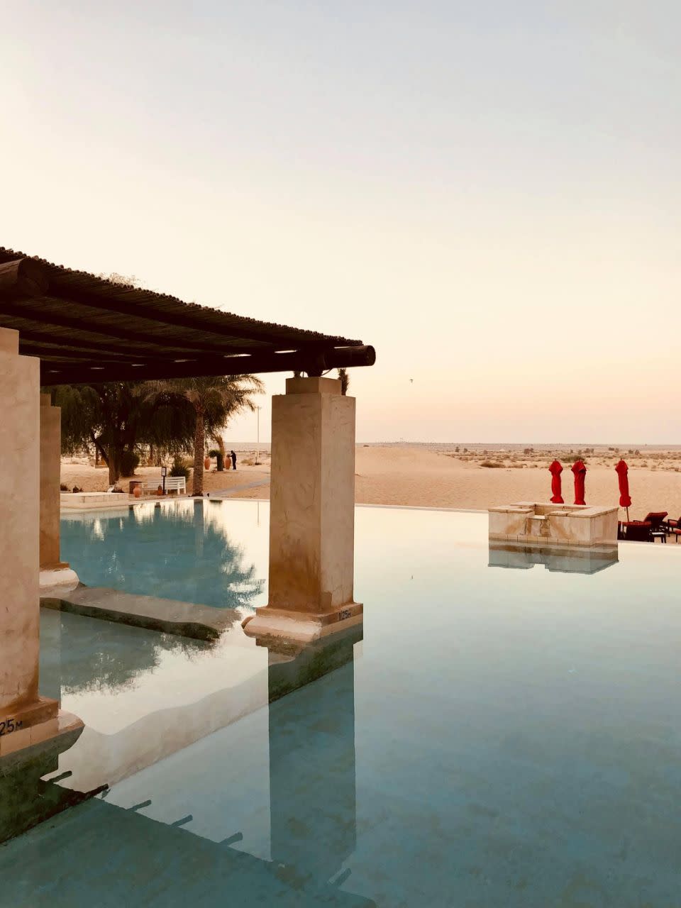 The hotel's pool boasts spectacular views of the Dubai desert.