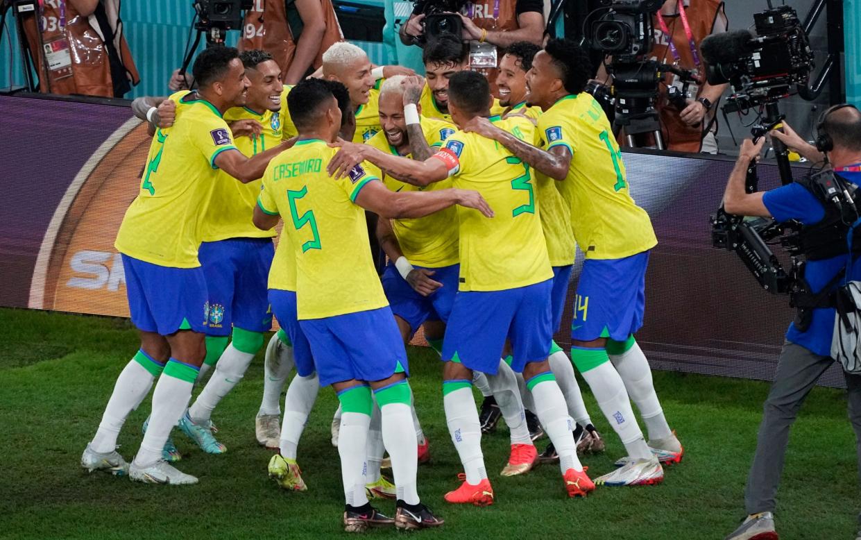 Neymar dances with his Brazil team-mates after their 4-1 win against South Korea in the last 16 - AP