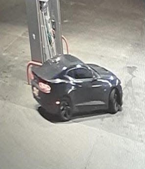 Photo of a dark colored Camaro the two suspects fled in released by Police.