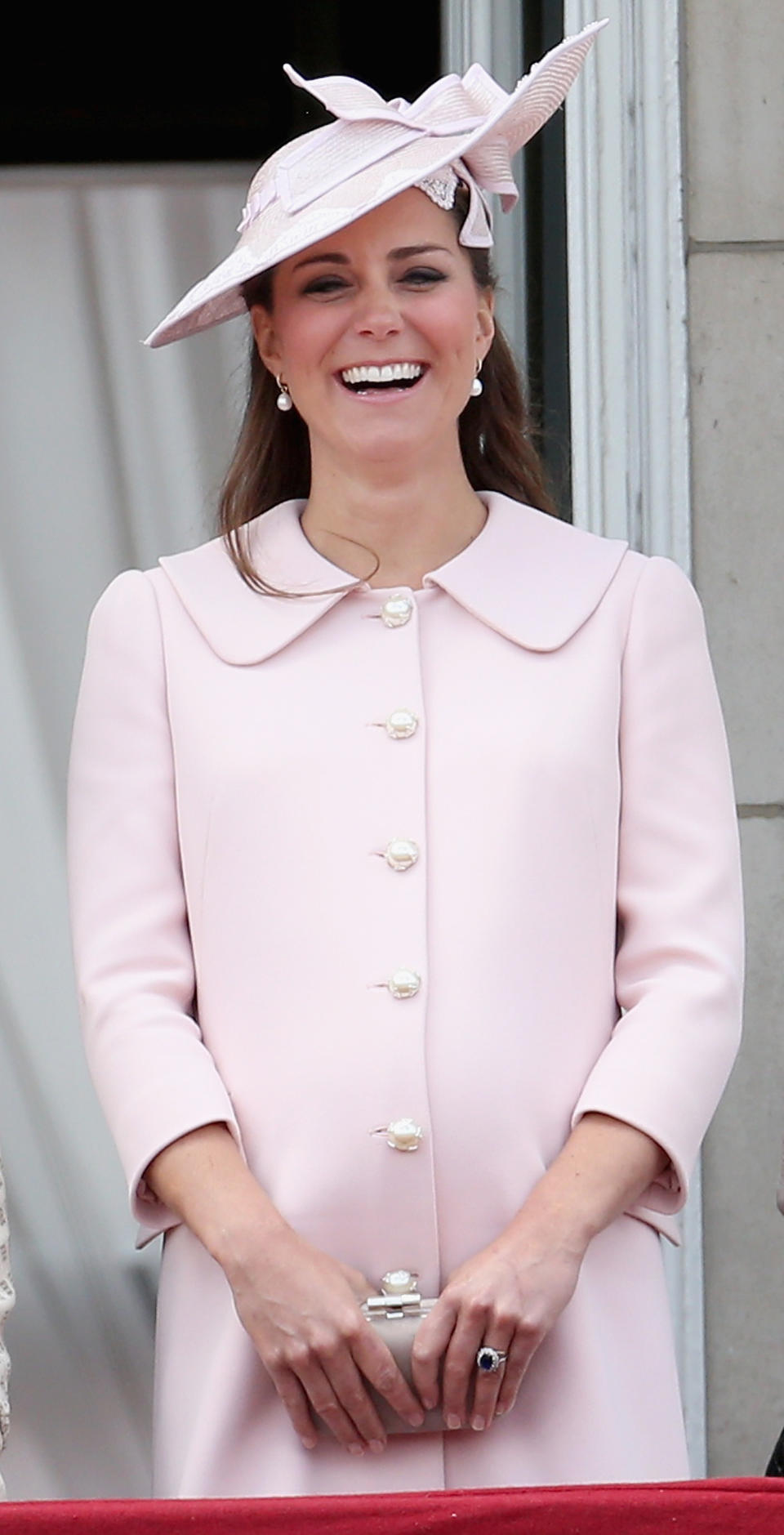 In 2013, the Duchess of Cambridge dressed her baby bump in a powder pink Alexander McQueen number finished with pearl buttons. (Rex pictures)