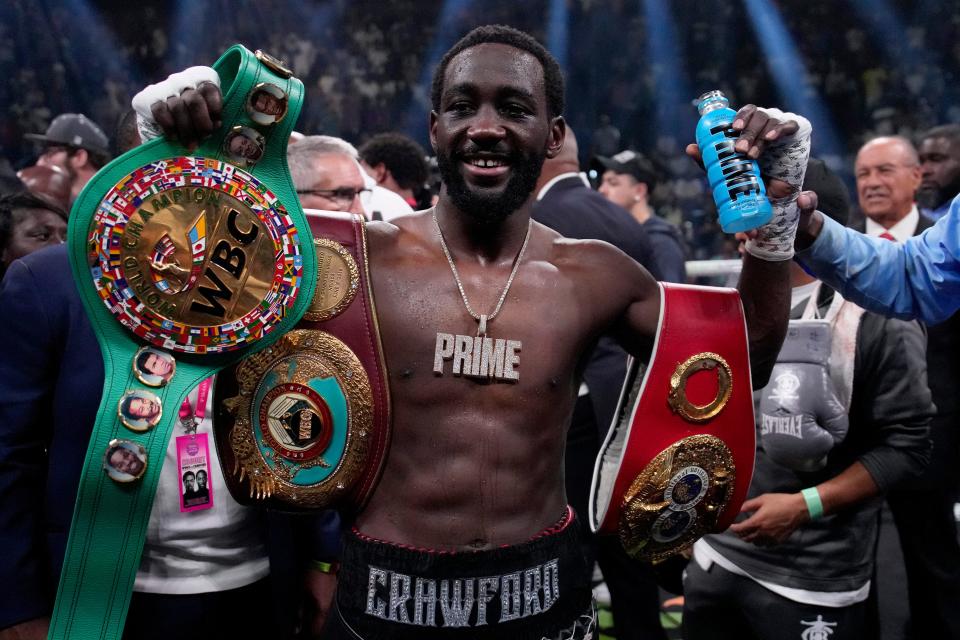 Terence Crawford celebrates after stopping Errol Spence Jr.