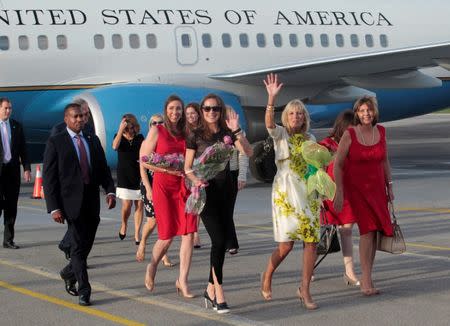 Jill Biden (2nd R), wife of U.S. Vice President Joe Biden, waves near Josefina Vidal (R), director of U.S. affairs at the Cuban foreign ministry, upon her arrival at Jose Marti airport in Havana, Cuba, October 6, 2016. REUTERS/Stringer