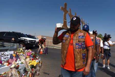 People pay their respects two days after a mass shooting in El Paso