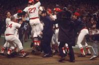 <p><strong>October 21, 1975</strong>: In the twelfth inning of Game 6 of the 1975 World Series, Boston catcher Carlton Fisk led off by sending Reds pitcher Pat Darcy's second offering deep to left. There was no question the ball would leave the yard, only on which side of the foul pole. Fisk took three sidestepping leaps toward first base, all the while waving his arms, as if trying to force the ball to stay fair. On the fourth leap, he thrust his fists into the air. "The visual is key there," said Richard Puerzer, a member of the Society for American Baseball Research. "The camera angle that they had showing him waving it fair was something that they didn't usually have."<br> </p>