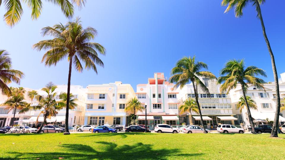 Art Deco buildings and palm trees on Ocean Drive in Miami Beach.