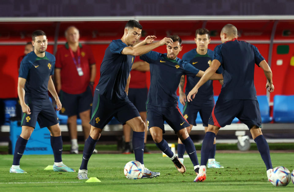 Pictured centre, Cristiano Ronaldo trains with his Portugal teammates ahead of the round of 16 clash against Switzerland. 