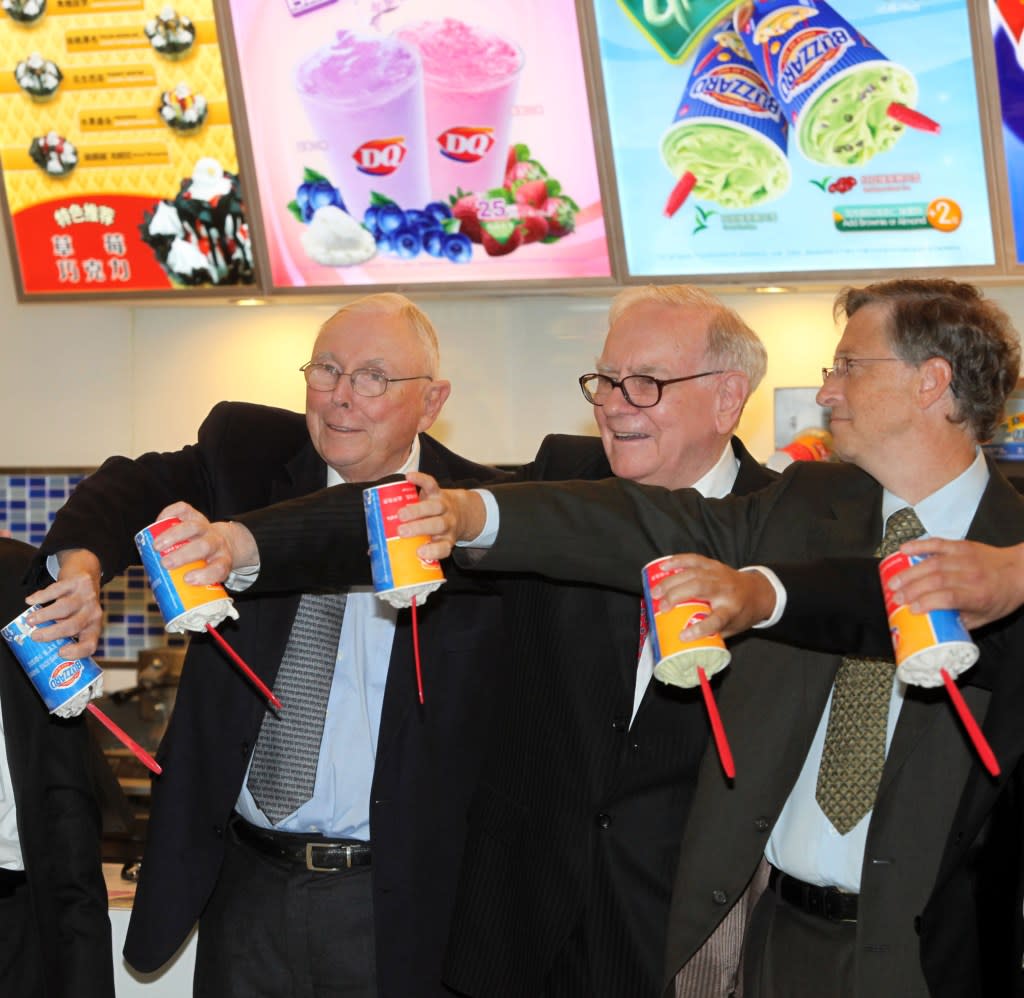 BEIJING - SEPTEMBER 30: (CHINA OUT) Charles Thomas Munger(L), Vice-Chairman of Berkshire Hathaway Inc., Warren E. Buffett(C), CEO of Berkshire Hathaway Inc., and Bill Gates(R), founder of <a href="https://fortune.com/company/microsoft/" rel="nofollow noopener" target="_blank" data-ylk="slk:Microsoft;elm:context_link;itc:0;sec:content-canvas" class="link rapid-noclick-resp">Microsoft</a> Inc., flip over their Dairy Queen drinks during an opening ceremony of a new banch of Dairy Queen at Chaoyang Joy City on September 30, 2010 in Beijing, China. Warren E. Buffett and Bill Gates are in China to meet the wealthiest of the country to encourage philanthropy. (Photo by Visual China Group via Getty Images)