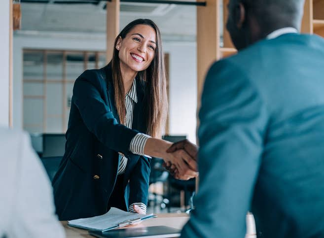 A man and woman shaking hands