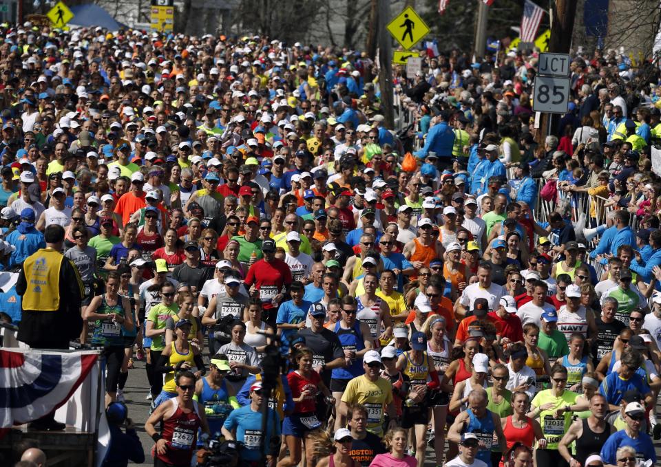 Runners compete near the start of the 118th Boston Marathon Monday, April 21, 2014 in Hopkinton, Mass. (AP Photo/Michael Dwyer)