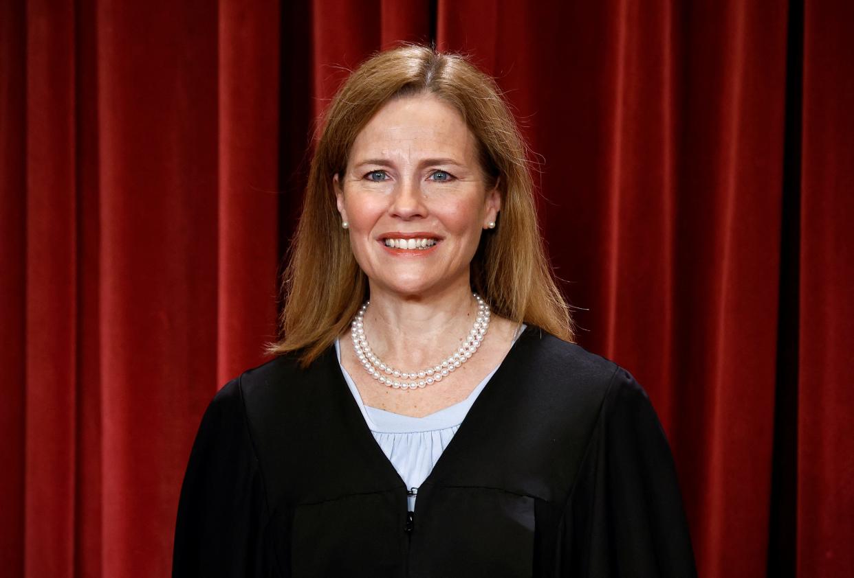 Supreme Court Associate Justice Amy Coney Barrett poses during a group portrait at the Supreme Court in Washington, on Oct. 7, 2022.