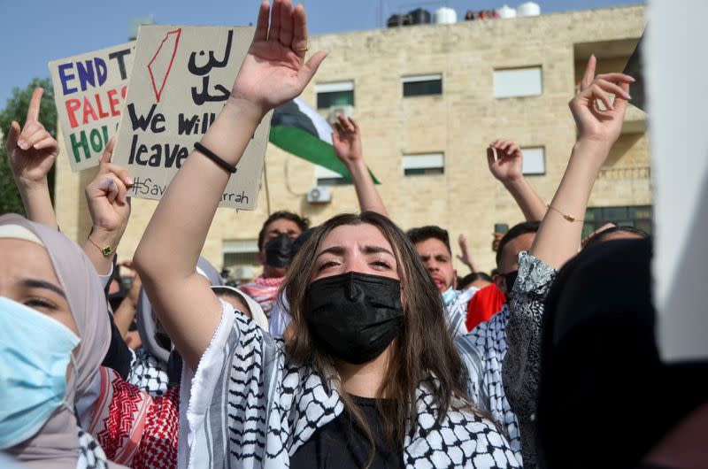 Jordanians demonstrate to express solidarity with the Palestinian people, near the Israeli embassy in Amman