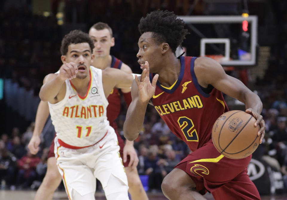 Cleveland Cavaliers' Collin Sexton (2) drives past Atlanta Hawks' Trae Young (11) in the first half of an NBA basketball game, Sunday, Oct. 21, 2018, in Cleveland. (AP Photo/Tony Dejak)