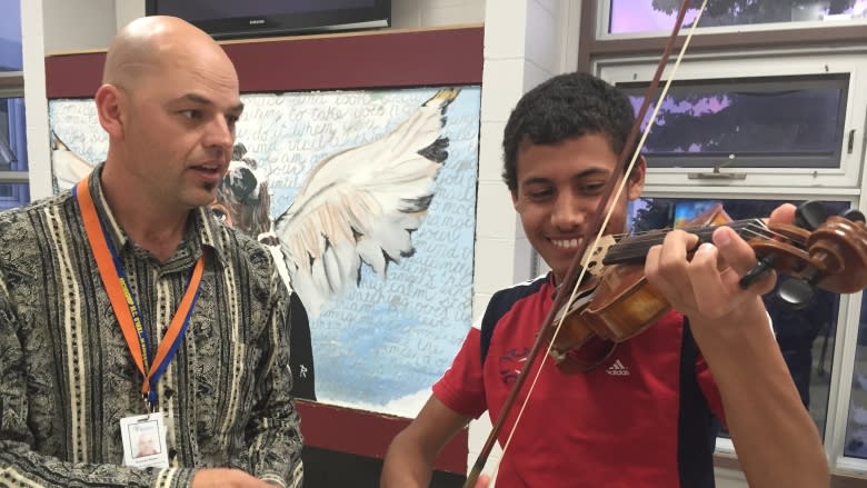 Practising English with students at Thom Collegiate's Community Coffee House