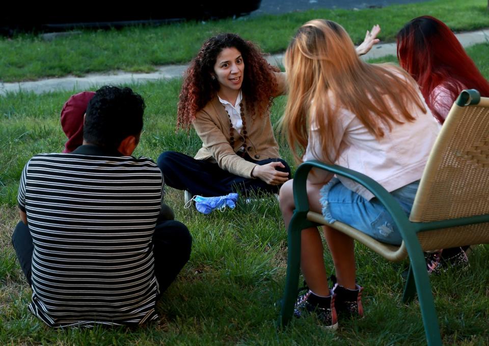 Attorney Claudia Cubas talks to Jose and his children in April