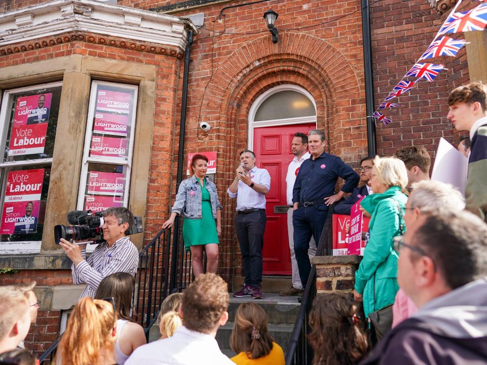 Kier Starmer (right) campaigning alongside Simon Lightwood with frontbenchers Jon Ashworth and Louise Haigh