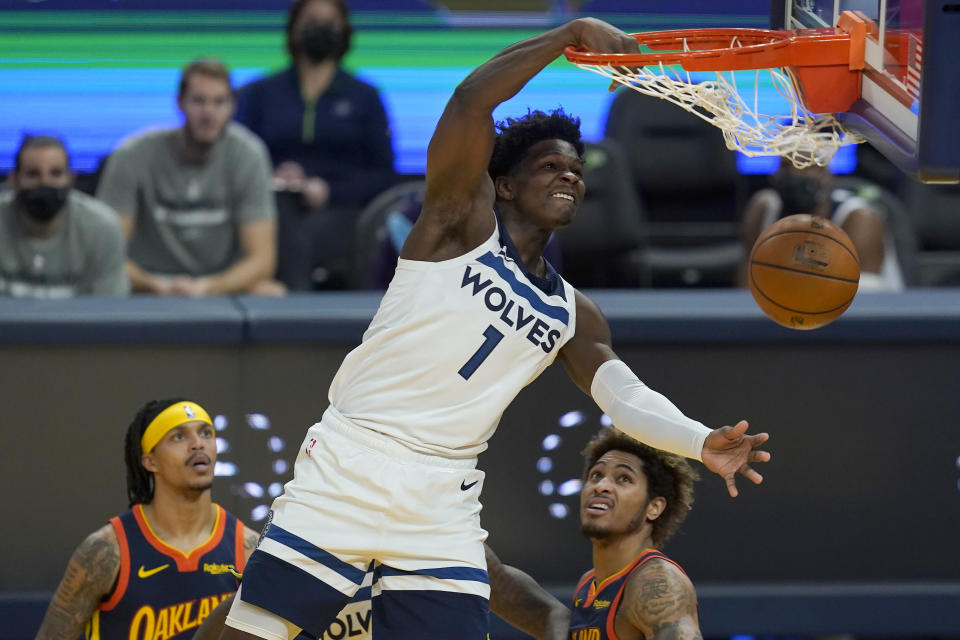 Minnesota Timberwolves guard Anthony Edwards (1) dunks against the Golden State Warriors during the first half of an NBA basketball game in San Francisco, Monday, Jan. 25, 2021. (AP Photo/Jeff Chiu)