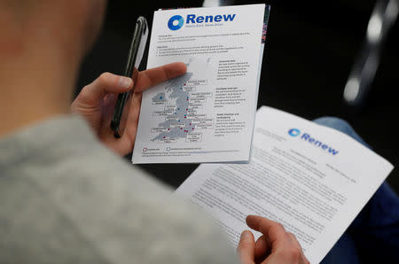 A journalist reads literature produced by the Renew party at press conference in London, Britain, February 19, 2018. REUTERS/Peter Nicholls