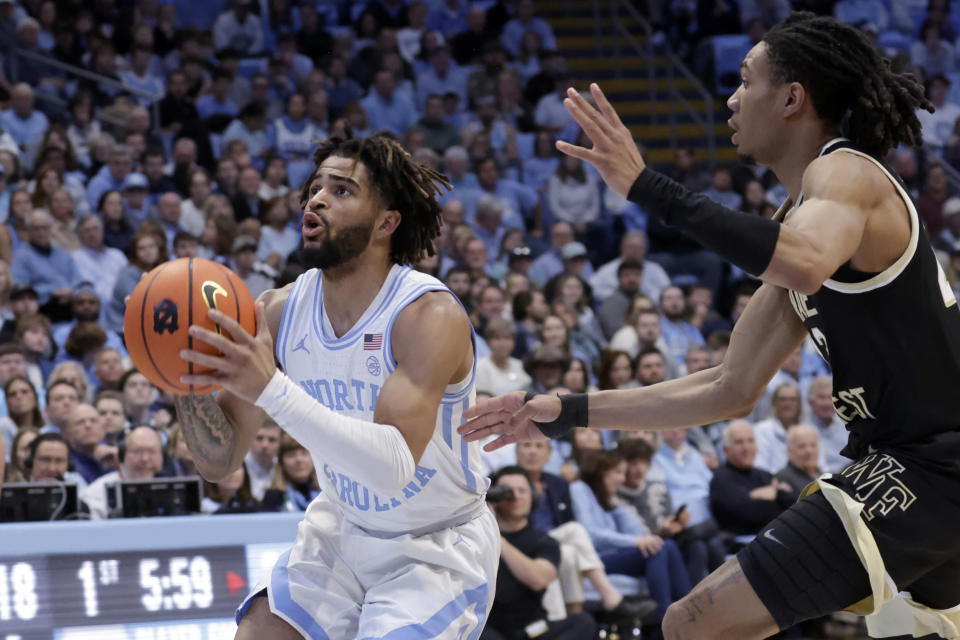 North Carolina guard RJ Davis sets up to shoot against Wake Forest guard Hunter Sallis, right, during the first half of an NCAA college basketball game, Monday, Jan. 22, 2024, in Chapel Hill, N.C. (AP Photo/Chris Seward)
