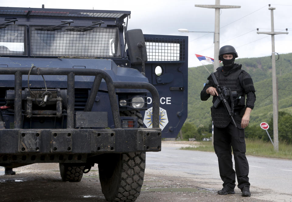 Kosovo police special unit members secure the area near the village of Cabra, north western Kosovo, during an ongoing police operation on Tuesday, May 28, 2019. A Kosovo police operation against organized crime in the north, where most of the ethnic Serb minority lives, has sparked tension, and Serbia ordered its troops to full alert. (AP Photo/Visar Kryeziu)