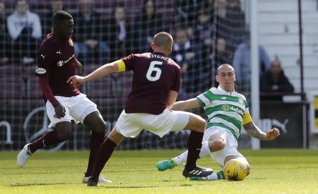 Britain Football Soccer - Heart of Midlothian v Celtic - Scottish Premiership - Tynecastle - 2/4/17 Celtic's Scott Brown in action with Hearts' Perry Kitchen Reuters / Russell Cheyne Livepic