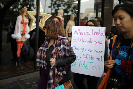 People participate in a protest march for survivors of sexual assault and their supporters in Hollywood, Los Angeles, California U.S. November 12, 2017. REUTERS/Lucy Nicholson