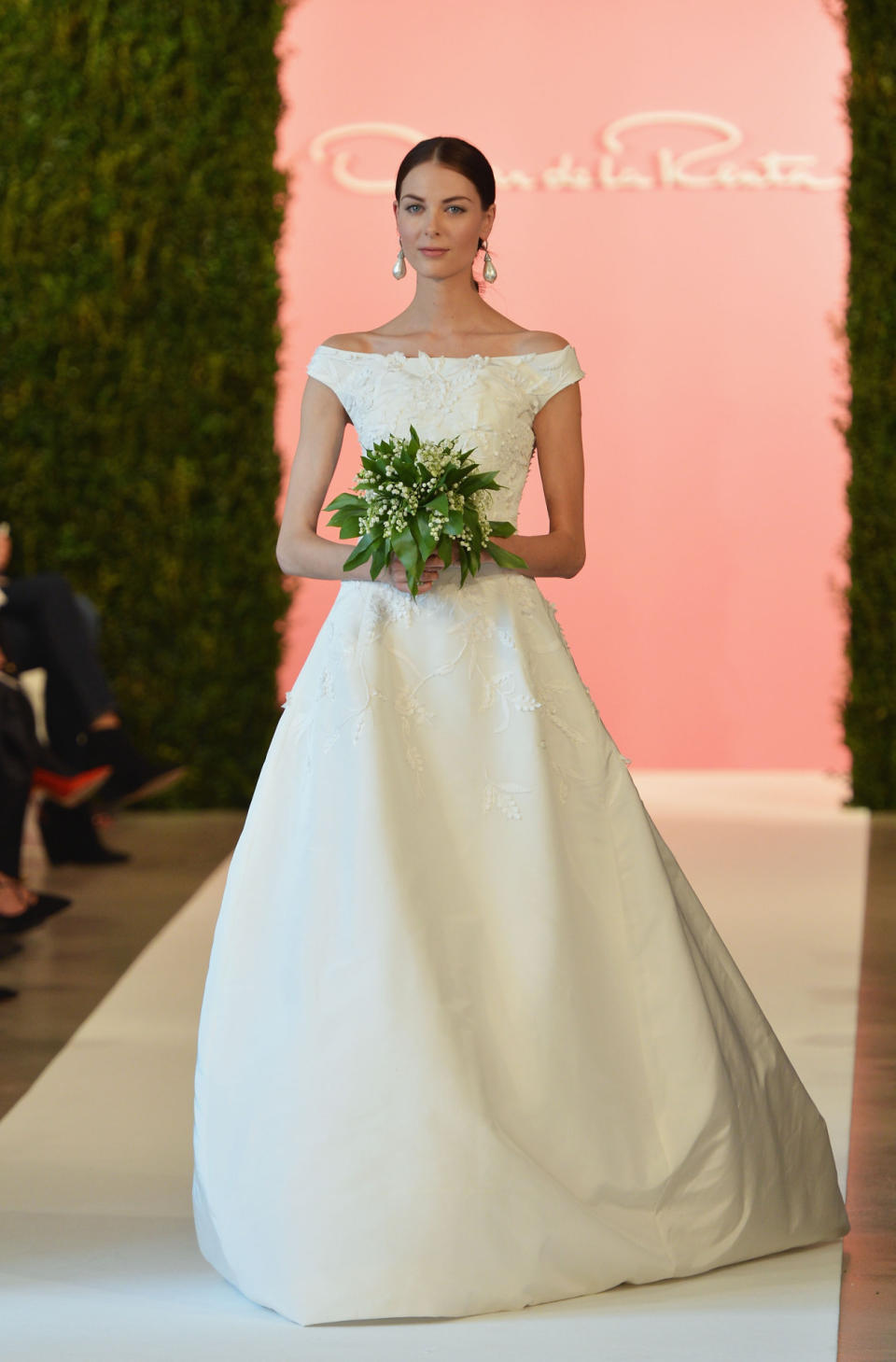 Back in April, the designer presented his latest wedding day creations that most brides would kill to wear. Hair was parted down the middle and gathered at the nap of the neck, while pink matte cheeks and pale lipgloss provided the finishing touches.