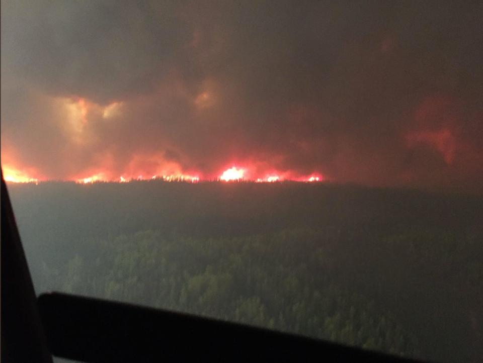 The Chuckegg Creek wildfire (HWF-042) burns out of control in the High Level Forest Area, to the southwest and west of the town of High Level, Alberta, Canada in this May 19, 2019 picture obtained from social media.  (Alberta Wildfire/via Reuters)